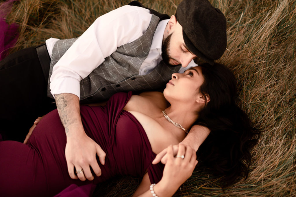 Maternity Session with Husband laying with Wife