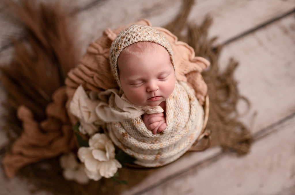Lansing Newborn Photographer For The Love Of Photography Picture of Newborn Girl Wrapped Posed in Bucket