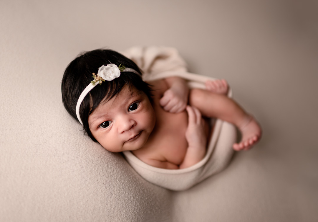 Lansing Newborn Photographer For The Love Of Photography Picture of Baby Girl Wrapped With Feet Out