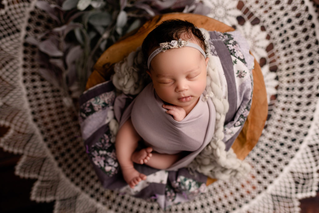 Lansing Newborn Photographer baby wrapped in purple by For The Love of Photography