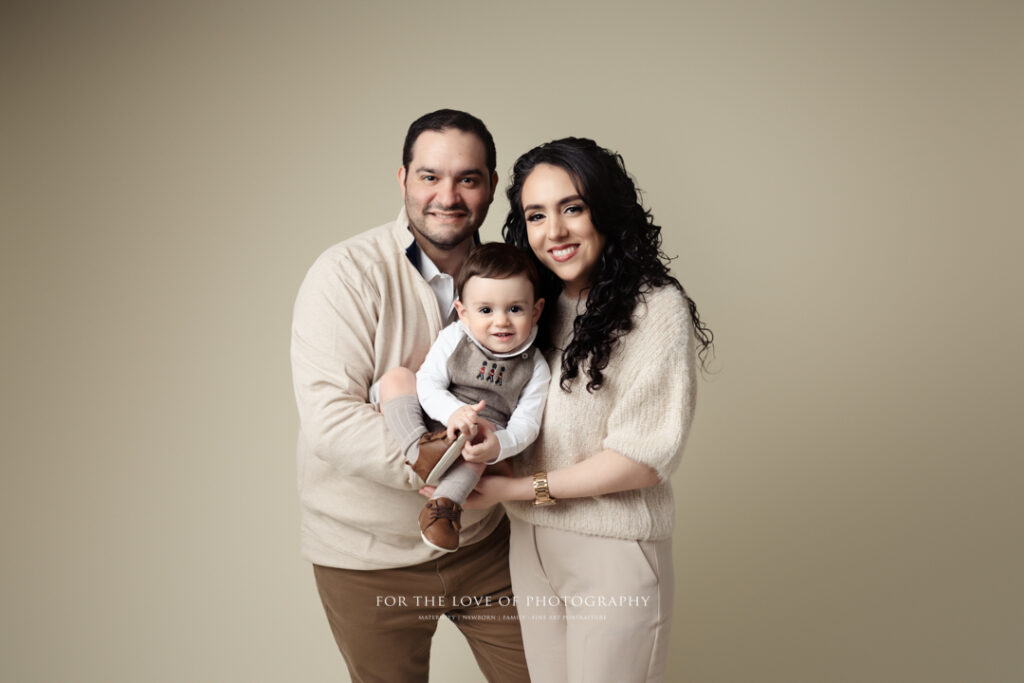 Lansing Milestone Photographer Family Holding Toddler by For the Love of Photography