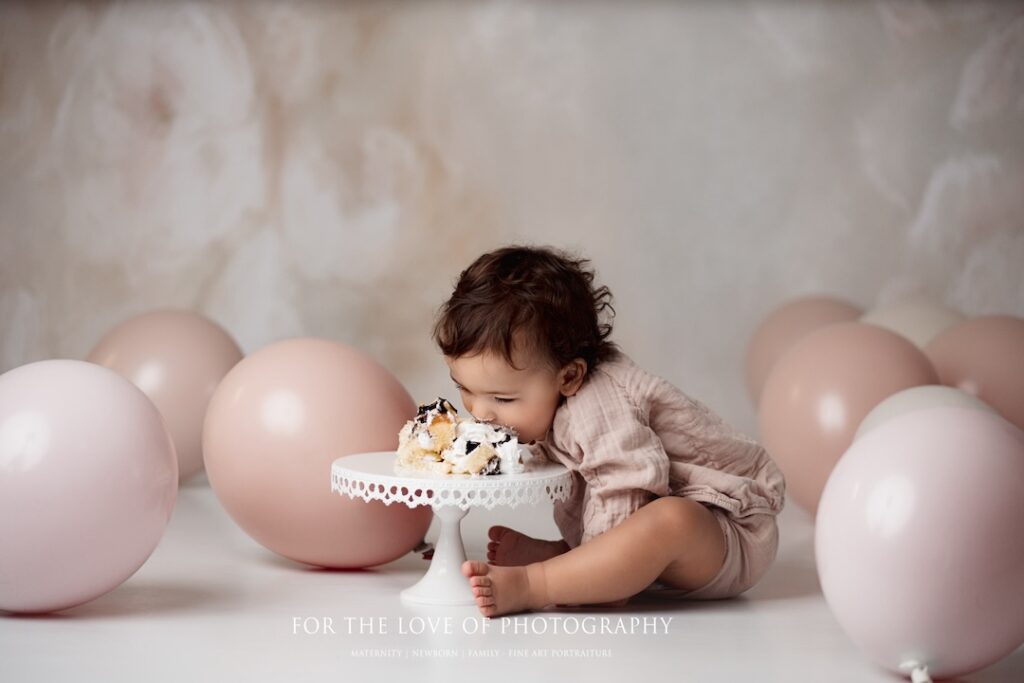 Toddler photo session eating cake by For The Love Of Photography.
