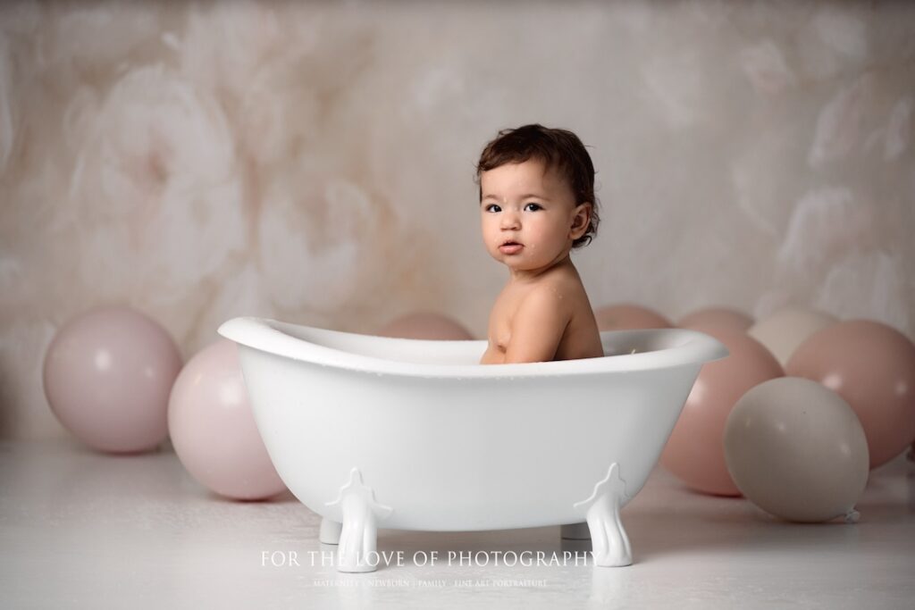 Toddler photo session sitting in bath by For The Love Of Photography.