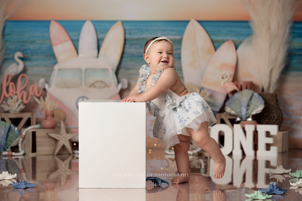 Baby standing at box